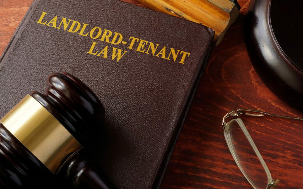 image of a gavel on a law book with the words Landlord-Tenant Law