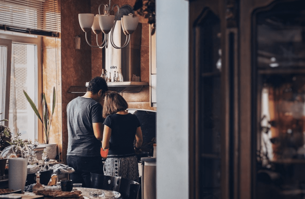 Couple in the kitchen of a home they bought together